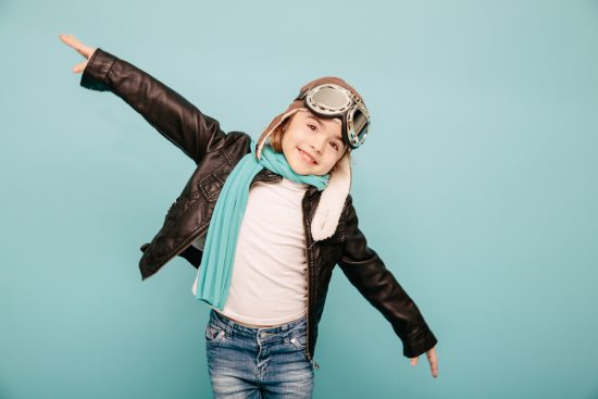 Girl "traveling" dressed like WWI pilot