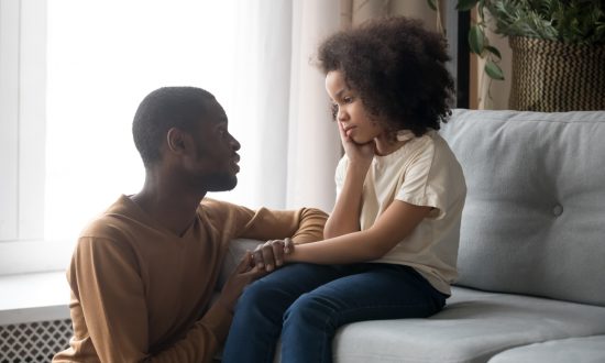 concerned father has conversation with child (illustration: obesity and parenting styles)