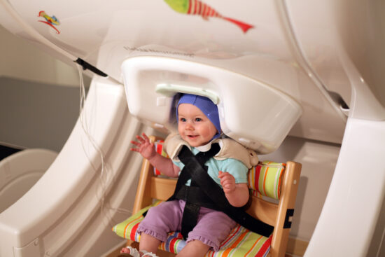 Baby inside magnetoencephalography brain-scanner