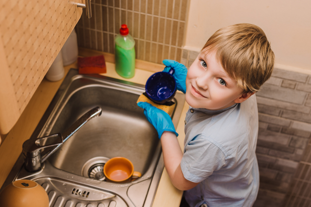 Ideal child helps wash dishes