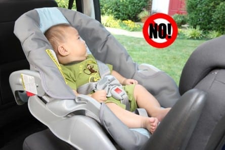 infant with incorrect loose harnessing (photo credit: NHTSA)