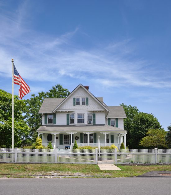 house with white picket fence