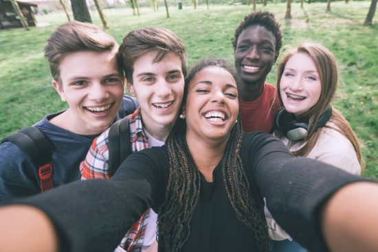 teens, tweens, using a smartphone use, selfie