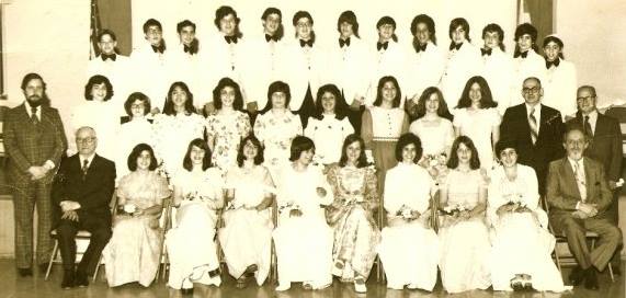 8th grade graduation, Merle is fourth from the left, front row. I'm fourth from the right, middle row.