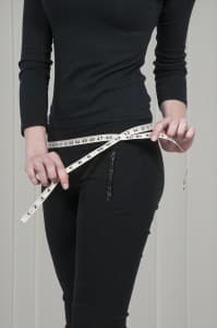 Woman measuring self