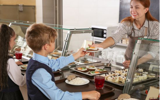 smiling lunch server school cafeteria