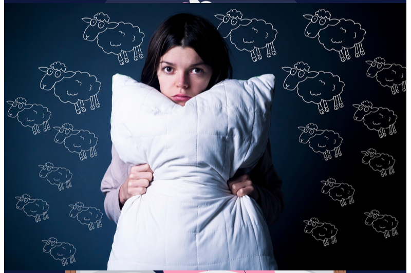 tired child hugs pillow against backdrop of sheep