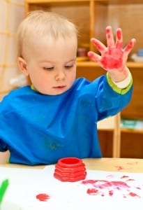 A toddler will be fascinated by his own handprint, made with fingerpaint.