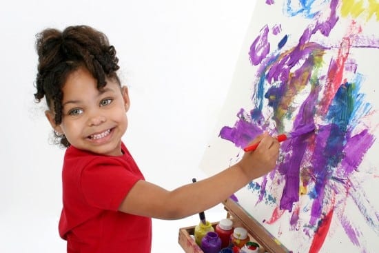 She'd paint all day if you'd let her. And why not? She's developing the skills that will help her learn to write.