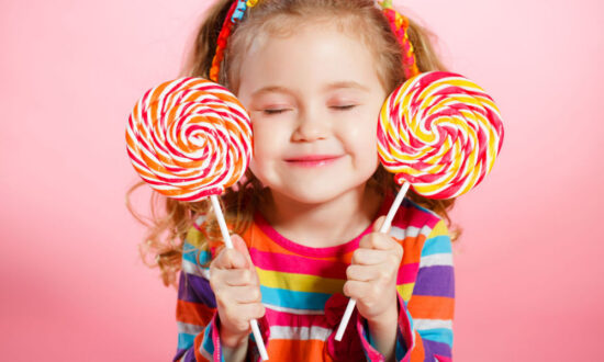 should you let your child eat candy girl closed eyes smiles lollypops