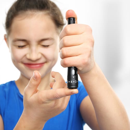 Girl Tests her glucose levels