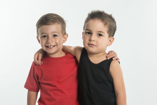 Little boys, best friends, hugging, facing camera