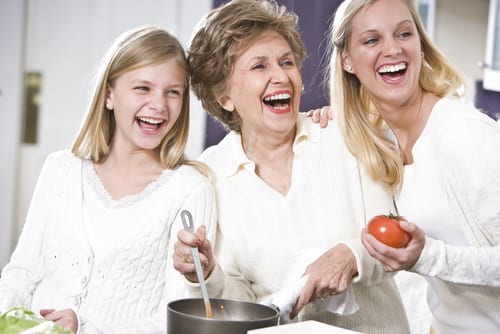 mother and two daughters volunteer at soup kitchen