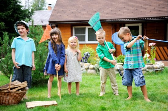 Children playing with all sorts of things in the backyard