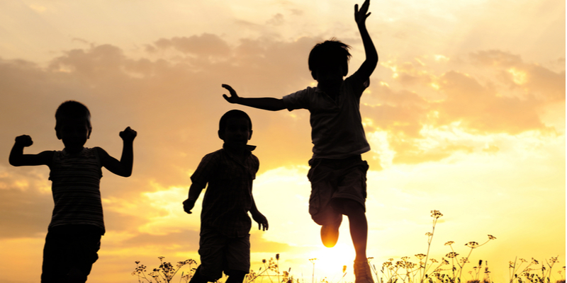 children playing in summer sunset