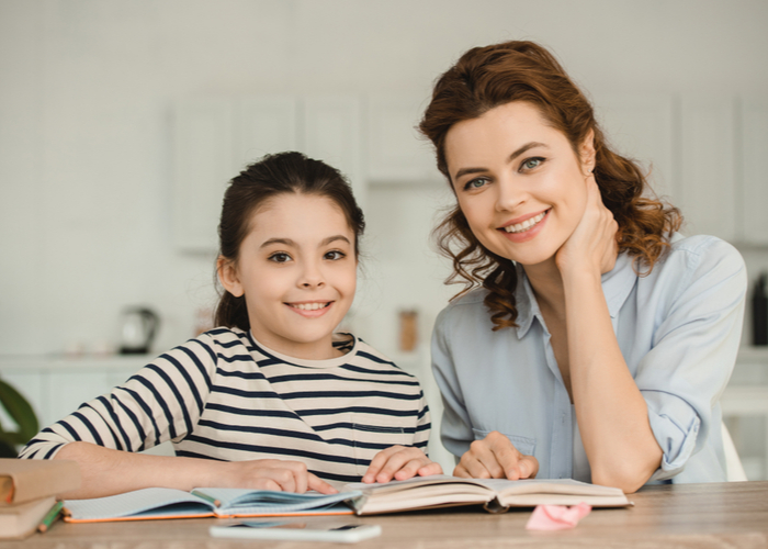 mother and daughter homeschooling