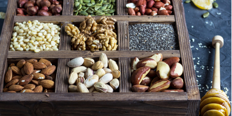 various nuts seeds wooden box