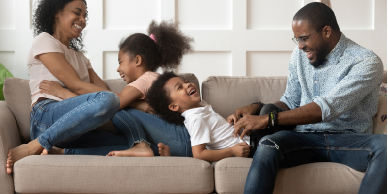 Family tickle on the couch