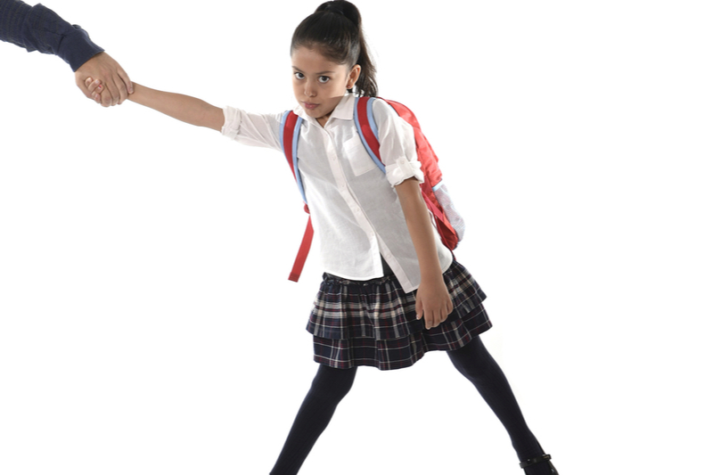 Pulling reluctant schoolgirl to school