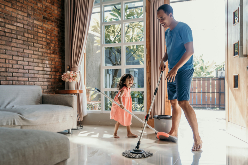 Little girl helps Daddy Clean