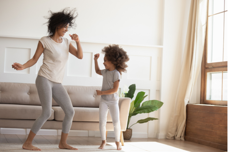 Mom and daughter dance hour in the living room