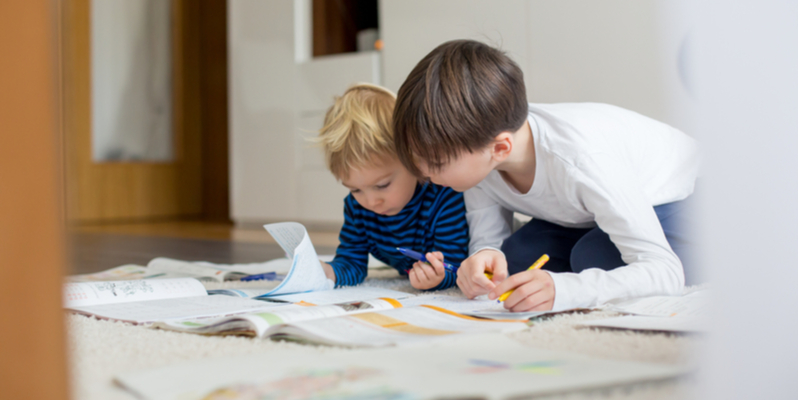 Brothers doing schoolwork at home during coronavirus lockdown