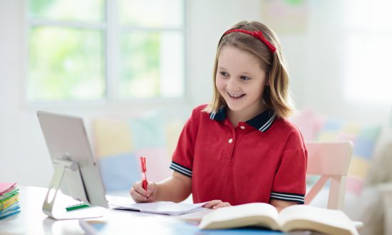 Girl does homework with friend via Zoom to counter coronavirus isolation