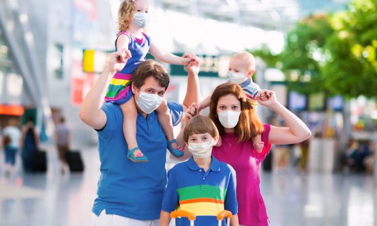 Family wears face masks in airport