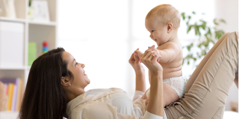 smiling mom and baby play