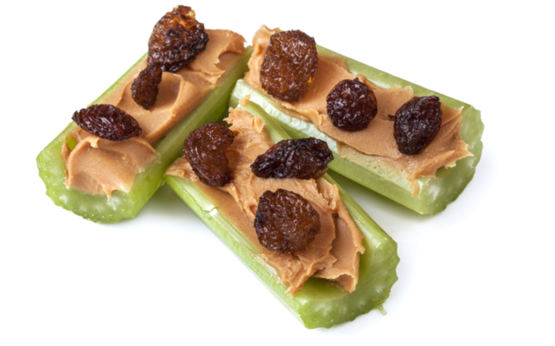 ants on a log, no-cook peanut butter filled celery boats, dotted with raisins