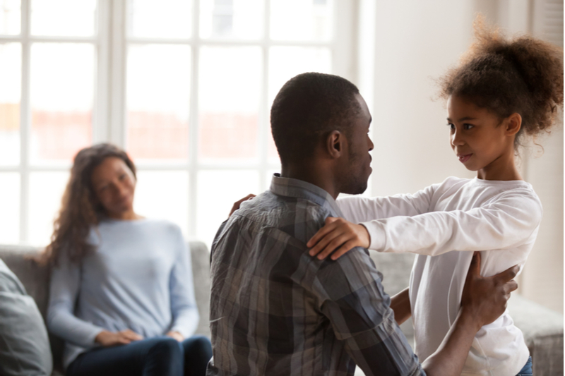 black father talks to daughter supporting and explaining