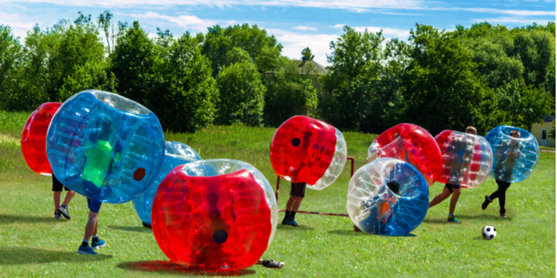 kids play bubble football