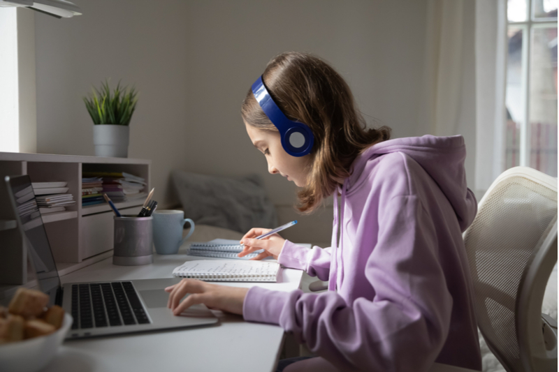 young girl does homework