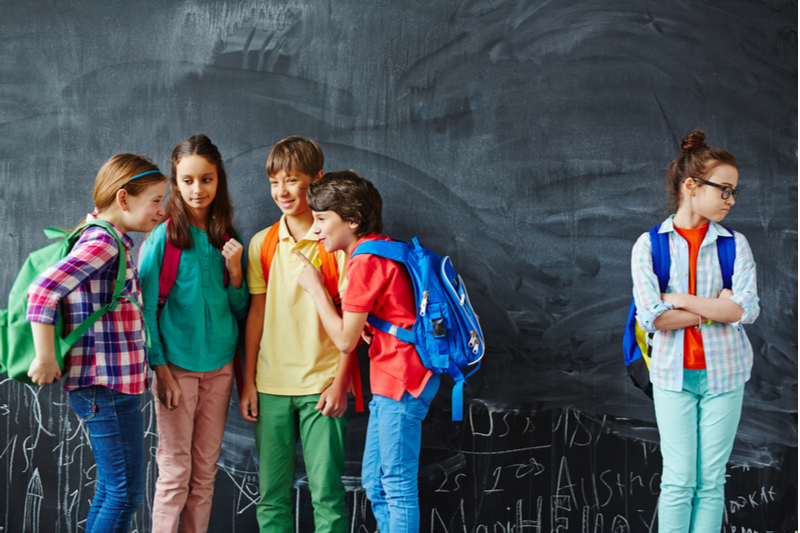 School kids gossip near subject