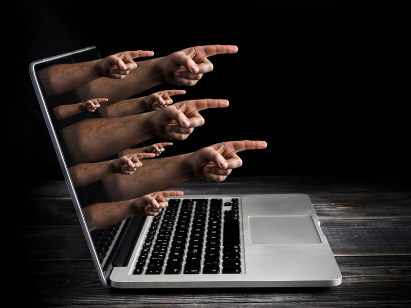 cyber bullying concept fingers screen blame