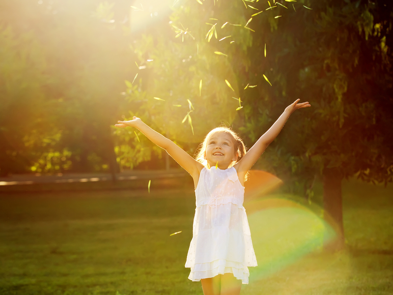 girl playing in sunshine