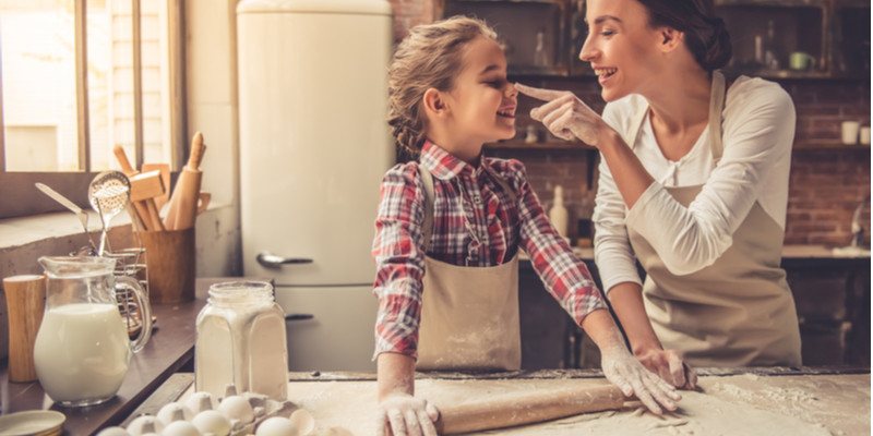 mom and daughter bake pie