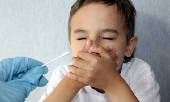 Coronavirus testing nasal swab scare boy covers nose and mouth