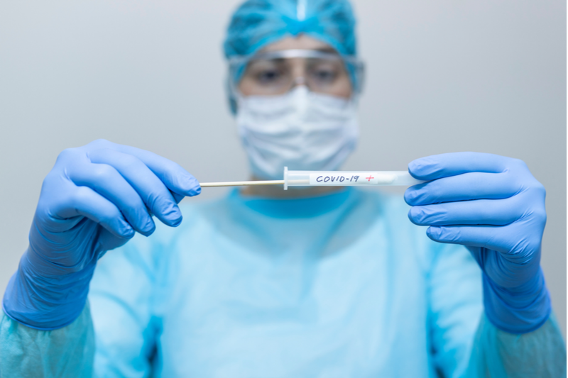 coronavirus testing technician preparing sample