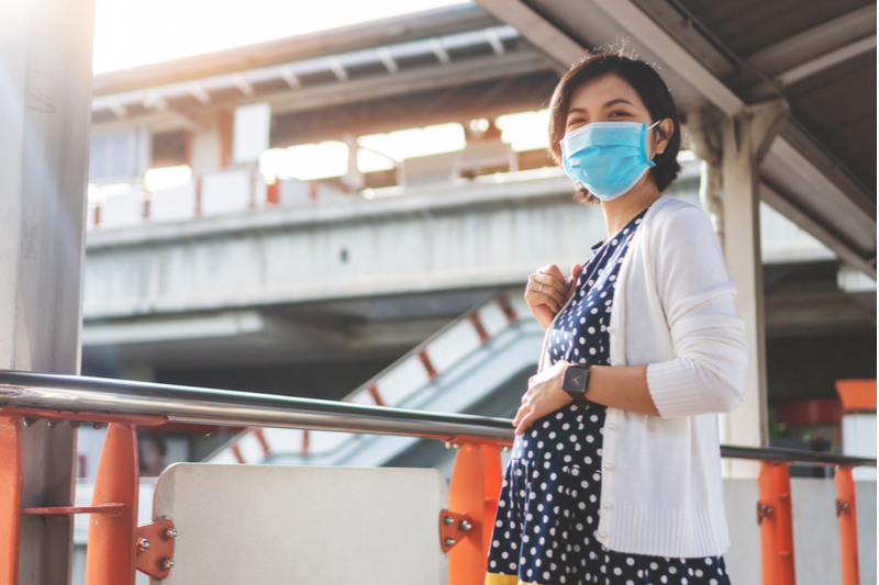 confident asian pregnant woman wearing face mask