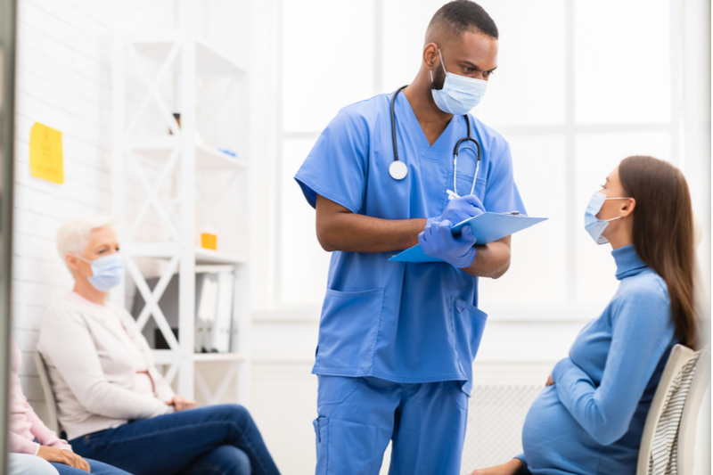 doctor appointment for pregnant woman with male doctor during pandemic