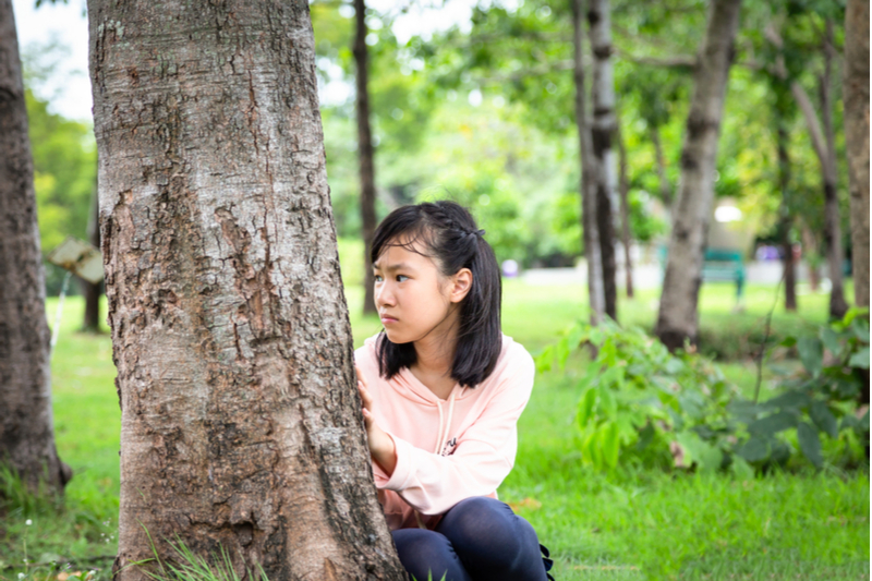 asian girl suffers paranoia is scared stressed nervous insecure