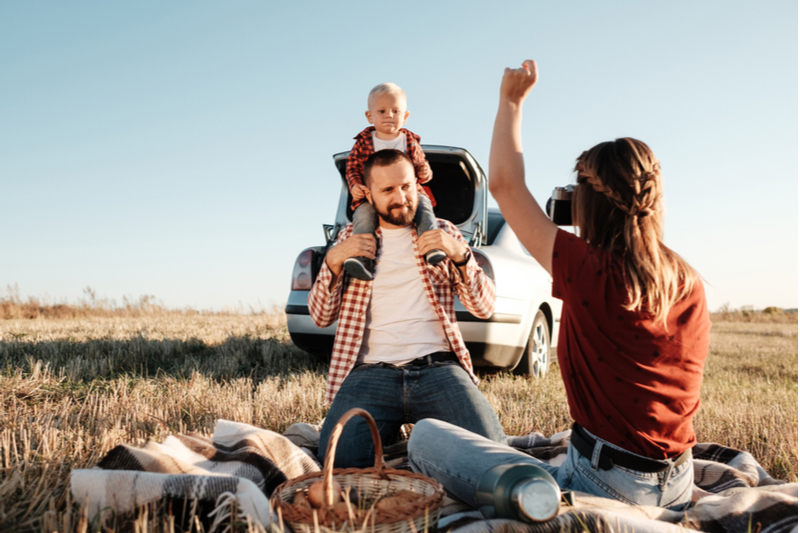 smile mom takes photo of special needs child during stop on road trip