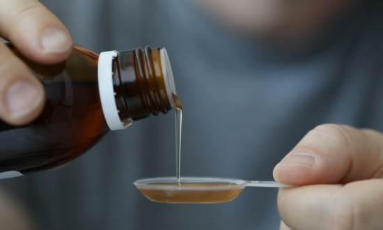 male hand pours cannabis oil