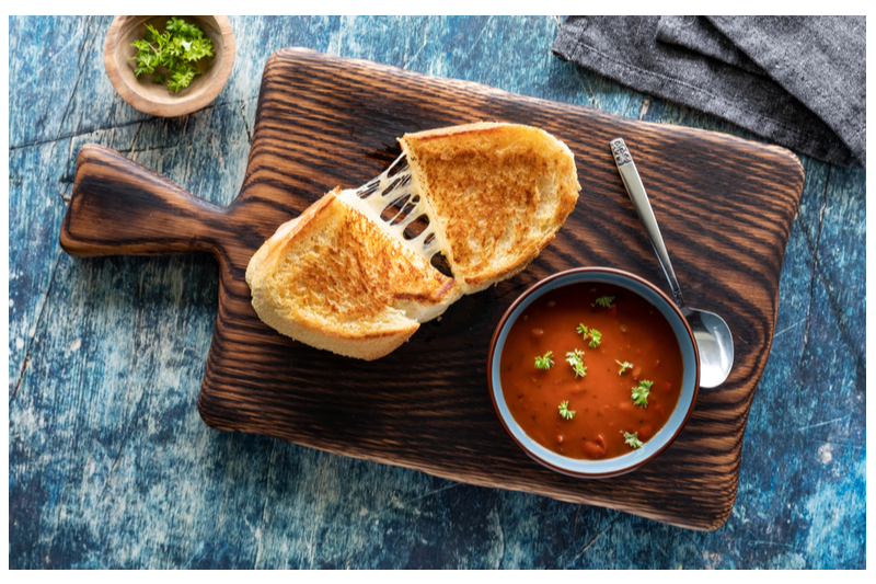 grilled cheese pulled apart bowl of tomato soup