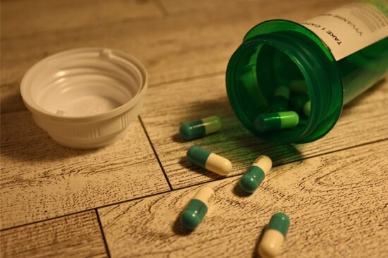 Nearly empty bottle of green pills Adhd meds