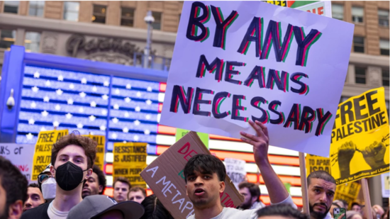 Campus protest sign By Any Means Necessary